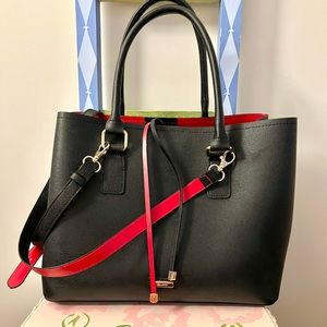 ALDO black handbag with red interior .